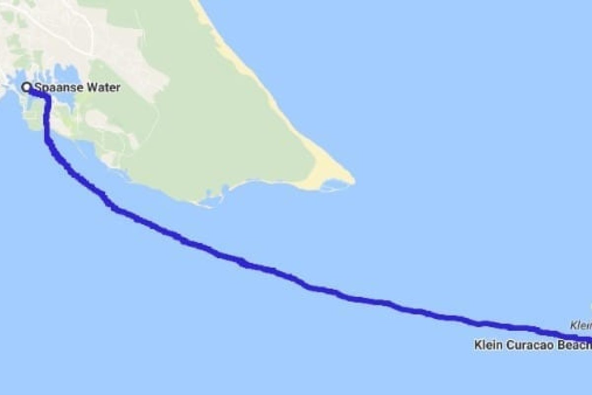 Map shows a blue route line for the "Klein Curaçao Sunset Cruise (Curaçao)" from Spanish Water on the main island of Curaçao to Klein Curaçao Beach, right through the Caribbean Sea.